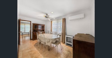 DECEPTIVELY SPACIOUS AND IN PRIME LOCATION! - Photo 2