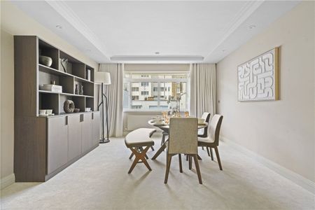A smart and spacious three bedroom flat on the first floor of this well run portered building with favoured south facing views over Gloucester Square itself. EPC rating: B | Council Tax Band H - Photo 2