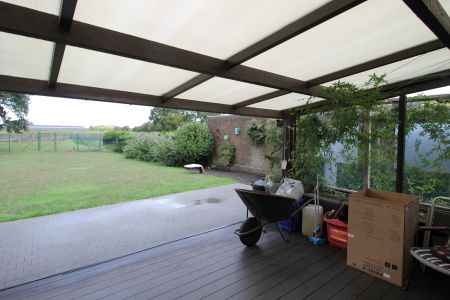 Een vrijstaande laagbouwwoning met 3 slaapkamers, tuin en inpandige garage. - Foto 4