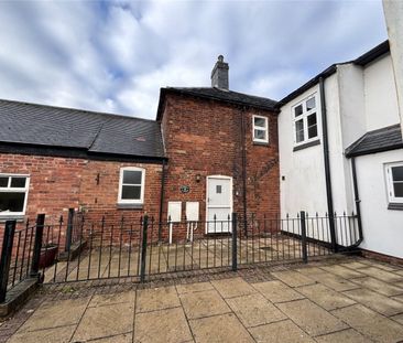 A 2 bedroom terraced cottage with a double garage and off-street pa... - Photo 1