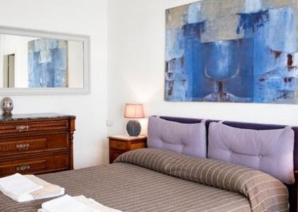 Attic-Monti: 1-6 month rentals. Spacious, furnished 3 Bedroom, 2 bath, living room, dining room, study and large panoramic terrace. Bright, silent, located in well kept Palazzo d’Epoca with elevator and doorman. Near transport and Metro.