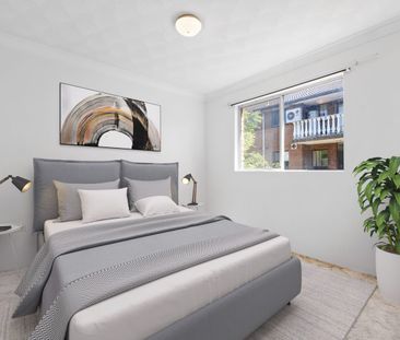 First-Floor Full Brick Two-Bedroom Unit with Single Garage! - Photo 3