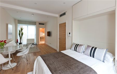 A beautifully refurbished studio apartment featuring solid wood flooring, air conditioning, bespoke storage and a pull-down bed. - Photo 4