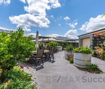 Low-Maintenance Living with Private Courtyard in Glenvale - Photo 1