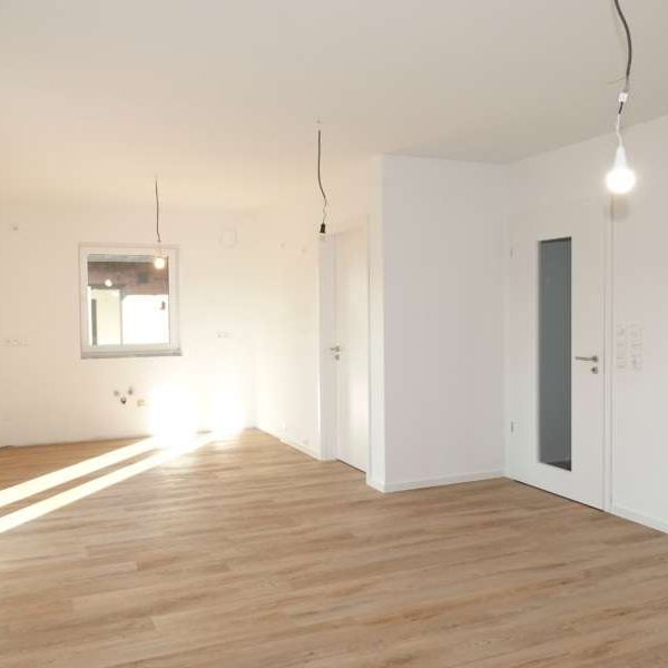 Helle Erdgeschosswohnung mit Terrasse in Wiesmoor – Neubau- Erstbezug! - Photo 1