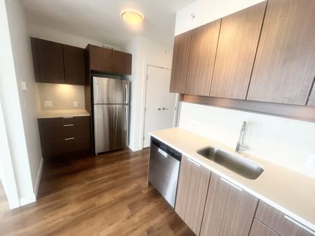 Great View from One Bedroom and Den with Parking in Convenient Surrey Central - Photo 4
