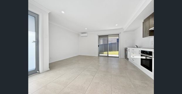 Coming Soon... Brand New Two Bedroom Duplex Home With A Single Garage - Photo 1