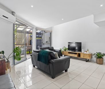 Bright and Airy Two-Bedroom Townhouse in Prime Location - Photo 2