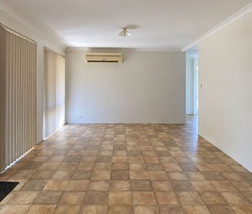 Neat 4-Bedroom Home with Monthly Lawn Mowing Included - Photo 1