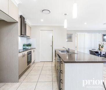 Spacious and modern lowset across from parkland - Photo 6