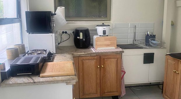 Unit under the house with private backyard - Photo 1