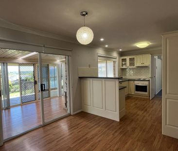 Bright Family Home with Sunroom and Outdoor Living Space - Photo 1