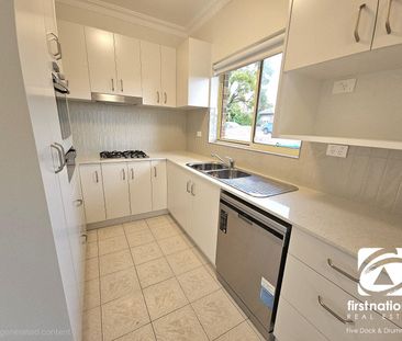 BEAUTIFULLY PRESENTED TOWNHOUSE WITH DOUBLE LOCK-UP GARAGE - Photo 4