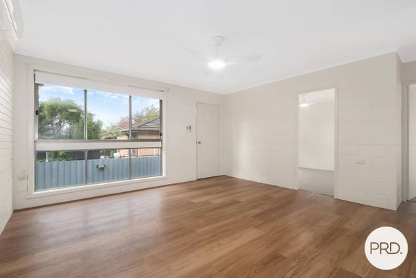 EASY CARE UNIT IN PRIME EAST ALBURY LOCATION! - Photo 1