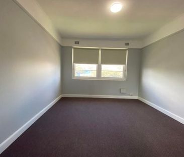 -Centrally located large two bedroom unit with sun room. - Photo 2