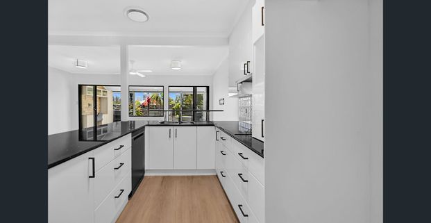 Skyline Views, Solar Savings & Three Brand-New Bathrooms — Your Bundall Haven Awaits - Photo 1