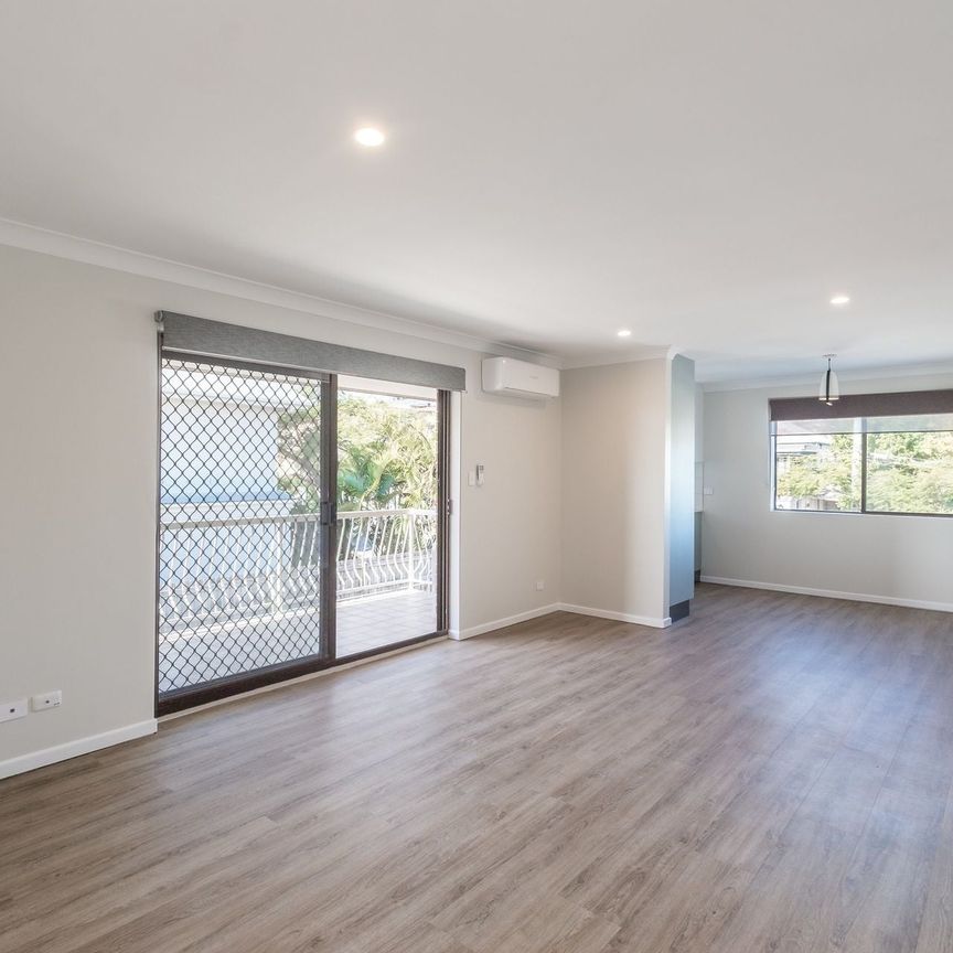 Beautifully Renovated Unit - Quiet Elevated Location, Easy Walk to Main Street Busway Station. - Photo 1