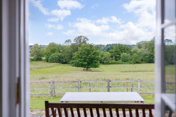 Grade II* listed 3 bedroom stable conversion set in a rural location with wrap around garden, parking and storage. - Photo 1