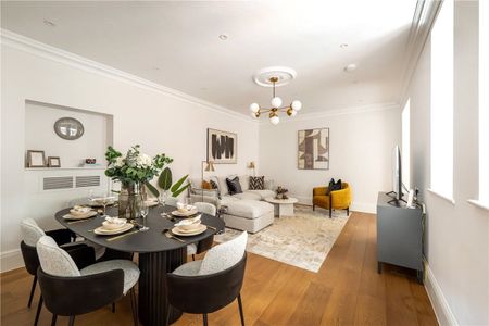A luxurious two-bedroom, two-bathroom lateral apartment in a prestigious red brick building on Stratton Street, Mayfair. - Photo 2