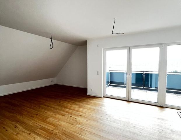 Exklusive Dachgeschosswohnung mit Balkon und Carport erwartet sie hier! - Foto 1