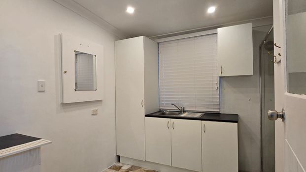 NEAT & TIDY STUDIO WITH OWN PARKING FOR RENT - Photo 1