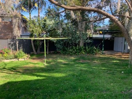 Charming Family Home with Spacious Backyard and Modern Comforts - Photo 4