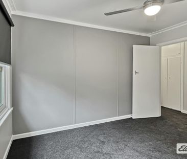 A beautifully renovated four-bedroom home - Photo 2