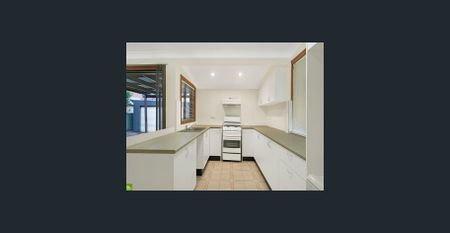 Beautifully Spacious Family Home - Lawn Maintenance Included For Your Convenience! - Photo 4