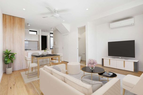 STYLISH DOUBLE-STORY APARTMENT WITH MODERN AMENITIES - Photo 1