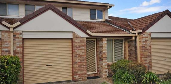 This comfortable 2-bedroom townhouse is in a perfect location - Photo 2