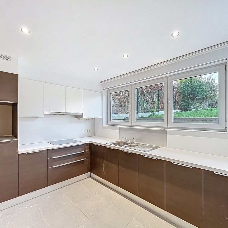 Gelijkvloers appartement met één slaapkamer en gezellige tuin te Dilbeek - Foto 1