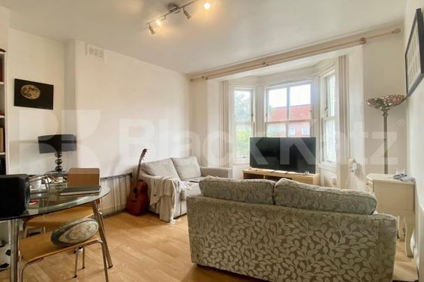 This recently refurbished property is flooded with natural light - Photo 1