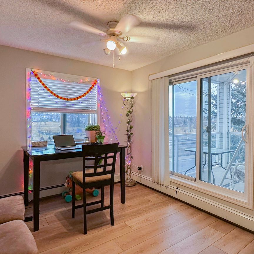 Spacious 2 Bed, 2.5 Bath Condo In Shawnessy | Fireplace, Balcony & Rent Incentive - Photo 1