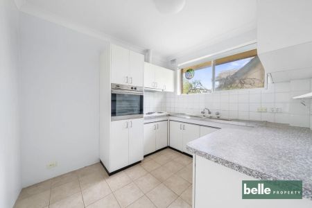 Freshly Renovated Top-Floor Retreat with Exceptional Privacy & Prime Location - Photo 4