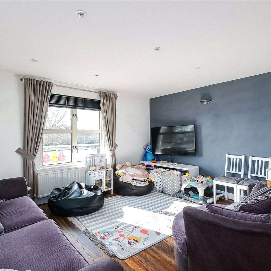 A substantial and open plan, south facing home with a very spacious kitchen / living room, two large double bedrooms, secure off street parking, balcony and wonderful harbour views. - Photo 1