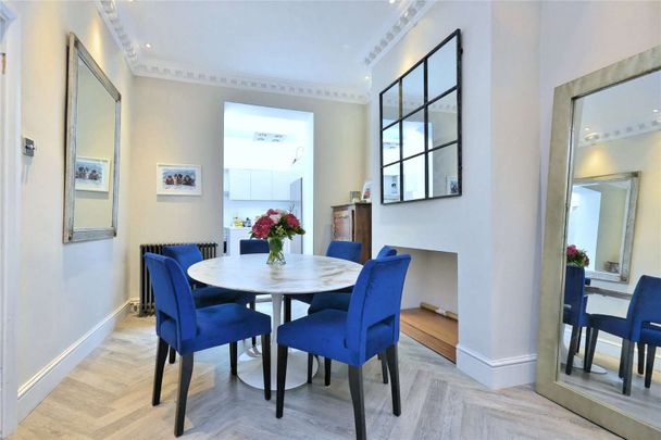 A beautifully presented four-five bedroom house situated on an elegant tree lined road. - Photo 1