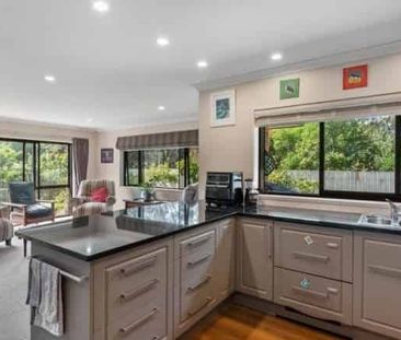 Spacious Four-Bedroom Home with Multiple Living Areas and Private G... - Photo 2