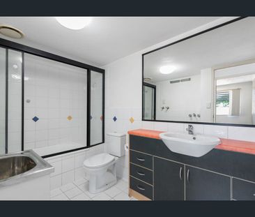 Charming Two-Bedroom Unit with Generous Private Courtyard in Secure... - Photo 4