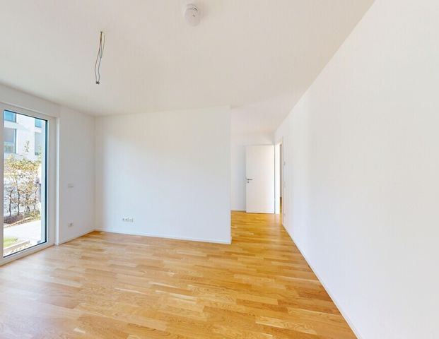 Neubau-Erstbezug: Attraktive Wohnung mit sonnigem Balkon und Erdgeschossterrasse! - Foto 1