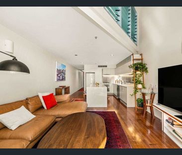 Stylish, Light-Filled Apartment with High Ceilings & Flexible Living - Photo 2