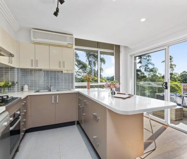 Light Filled Apartment with Oversized Lockup Garage - Photo 6