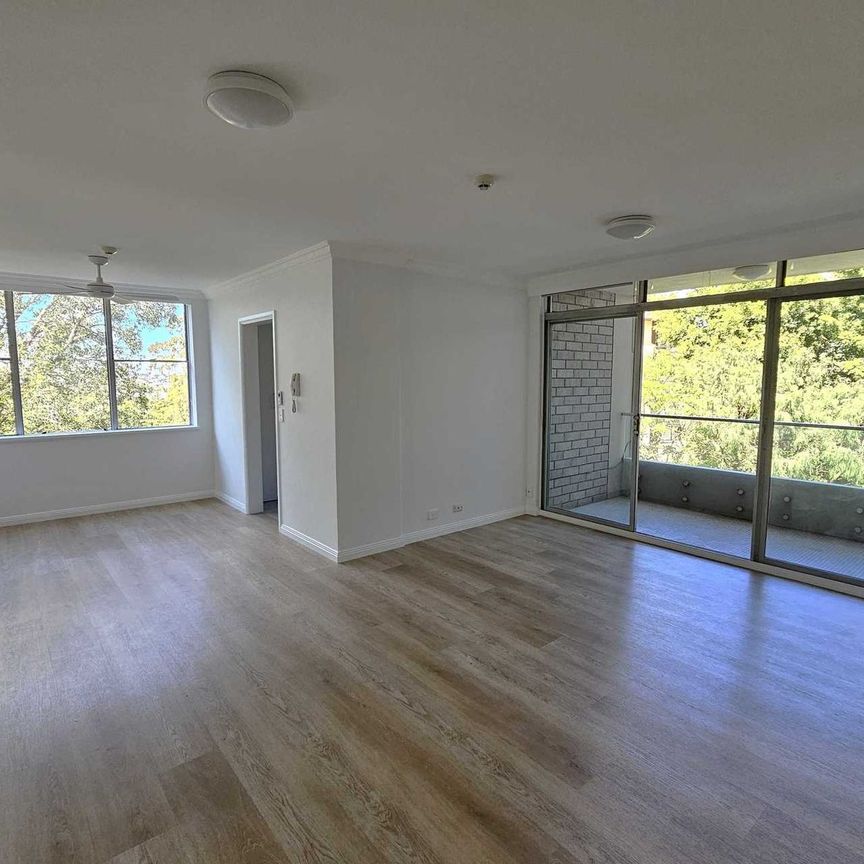 IMPECCABLY RENOVATED APARTMENT OFFERING COMFORT, STYLE AND CONVENIENCE - Photo 1