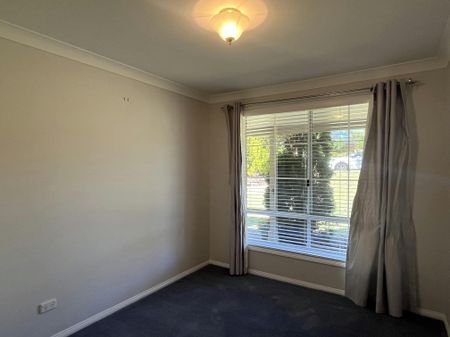 Bright Family Home with Sunroom and Outdoor Living Space - Photo 4