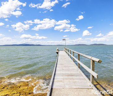Family Haven with Waterfront Views - Photo 1