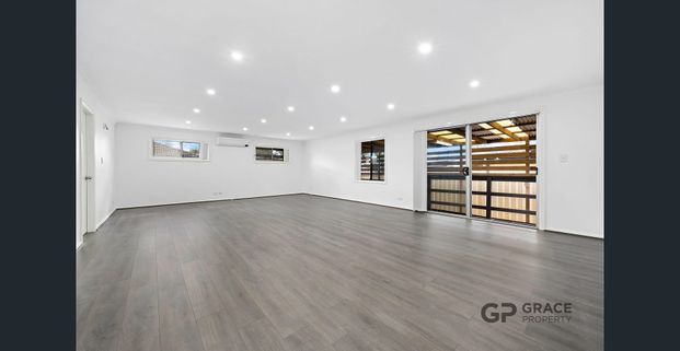 Spacious 5-Bedroom Home in a Prime Location - Photo 1