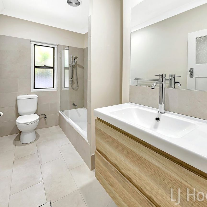 Post War charm and character with central location to Cannon Hill Plaza! - Photo 1