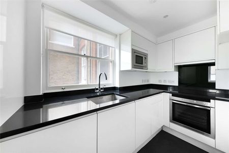 A first and second floor duplex apartment in a recently refurbished building benefitting from two bedrooms and one bathroom with wooden flooring and lift access. - Photo 5