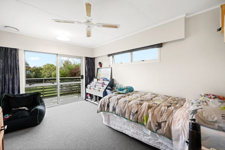 This modern four-bedroom, two-bathroom home offers the perfect blend of comfort and convenience. - Photo 2