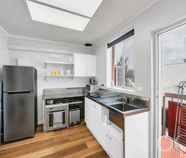 Open the Door to Low-Maintenance Living with Balcony Charm - Photo 5