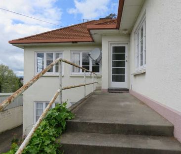 This is a tidy, character three bedroom upstairs unit with all orig... - Photo 4